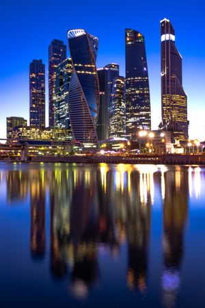 Moscow's skyline across the river during night time