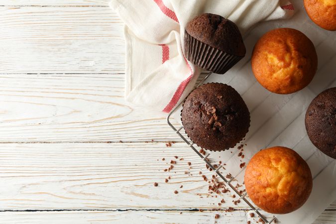 Composition with tasty muffins on wooden background