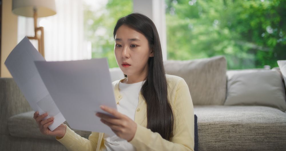 Female South Korean Professional Working in Remote Employment, Mastering Projects and Collaborating Online on Her Laptop Computer