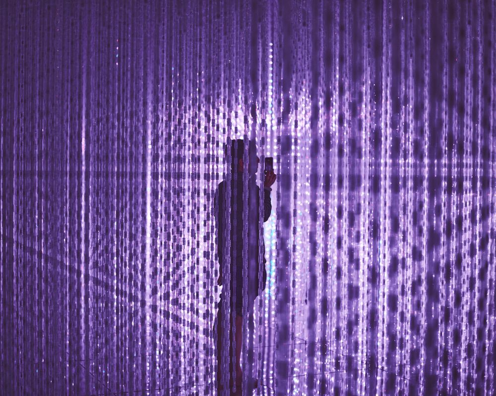 Tokyo, Japan - November 19th, 2019: Man inside purple art installation