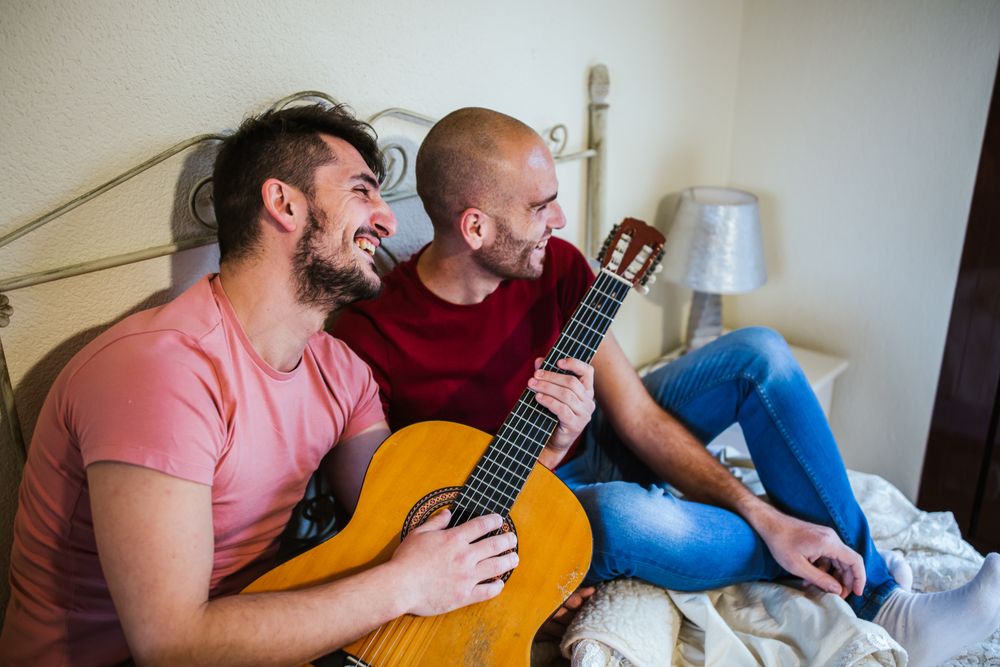 gay couple with guitar
