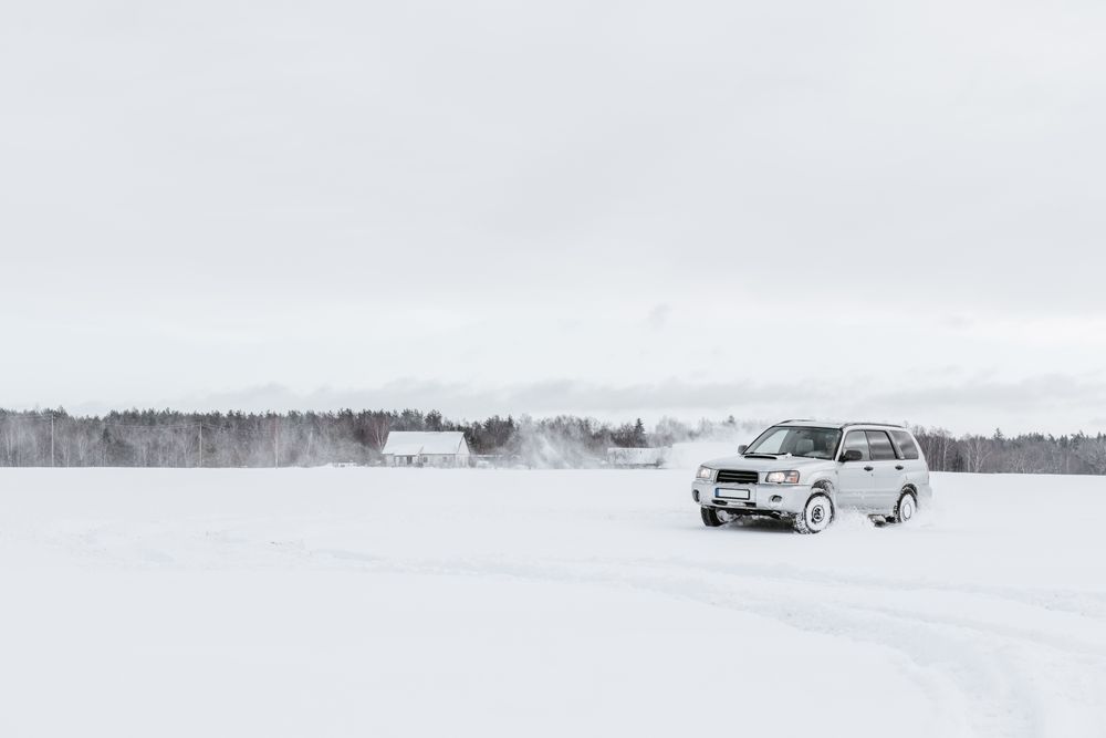 Car driving on snow field