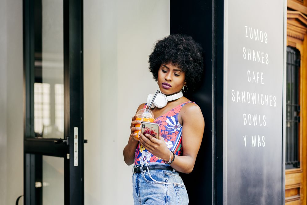 Woman in lunch cafe with headphones