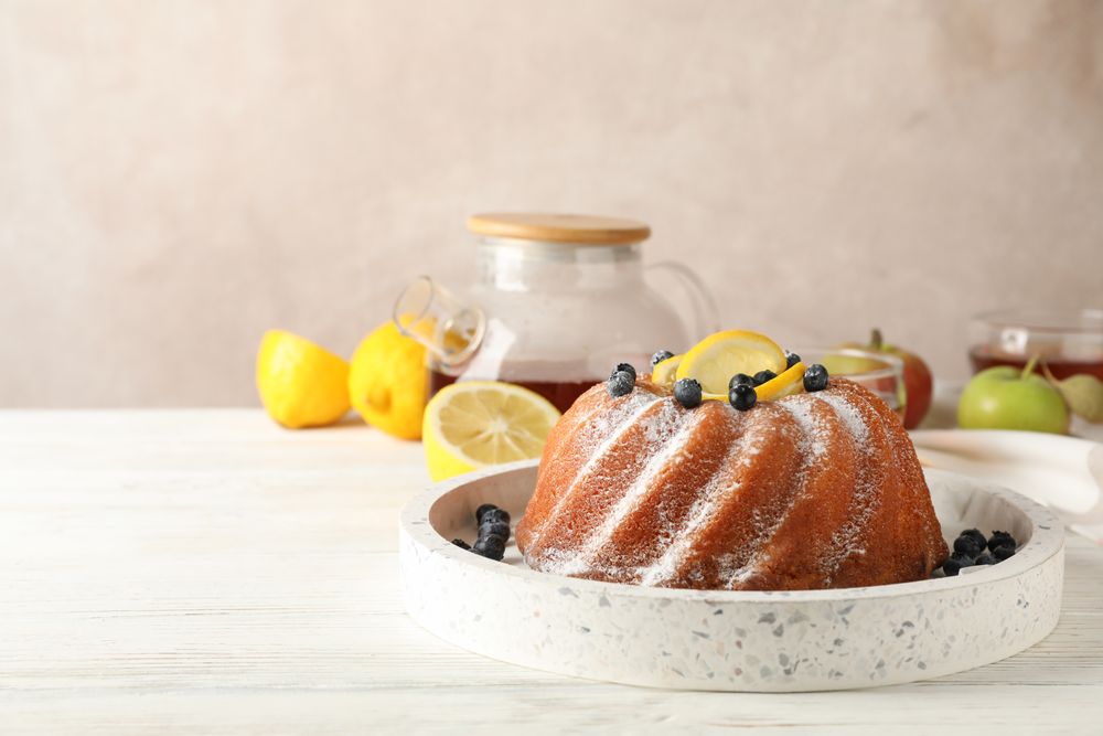 Cake with powder sugar and lemon, space for text