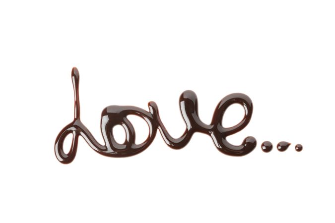 Word Love made of chocolate sauce isolated on blank background