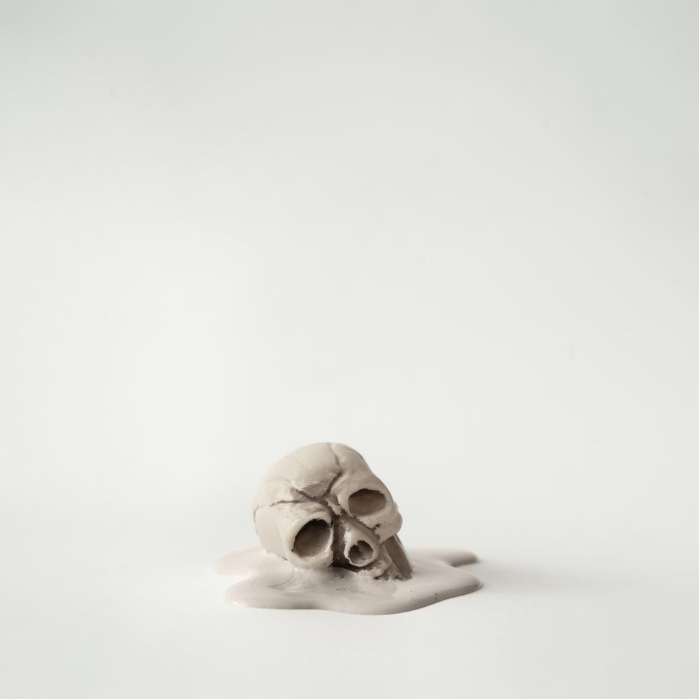 Melting skull on light background