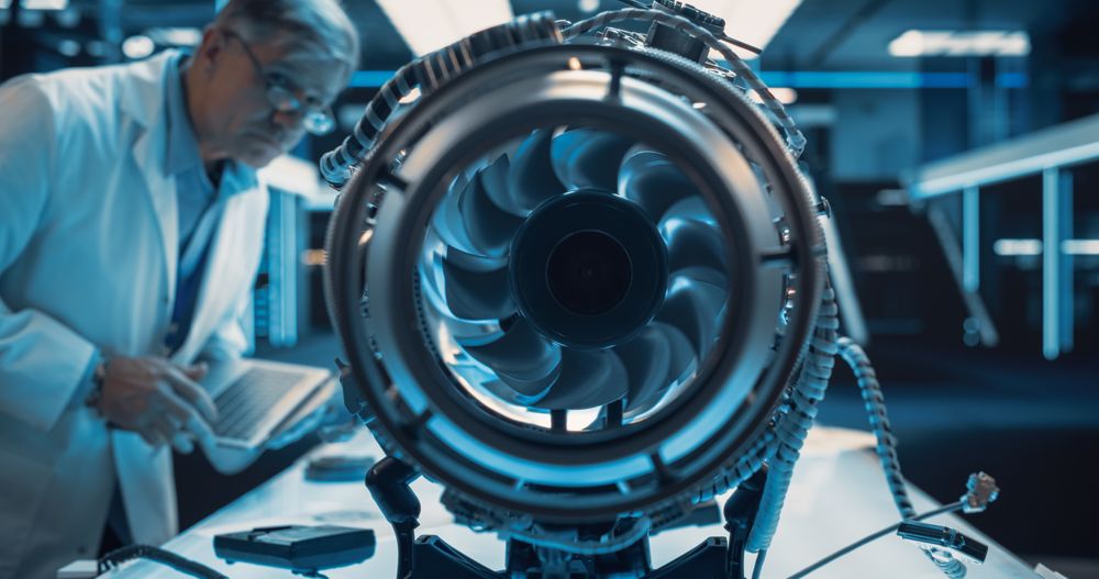 Mature Industrial Turbine Specialist Working on an Innovative Invention.