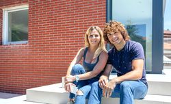 Couple in front new house