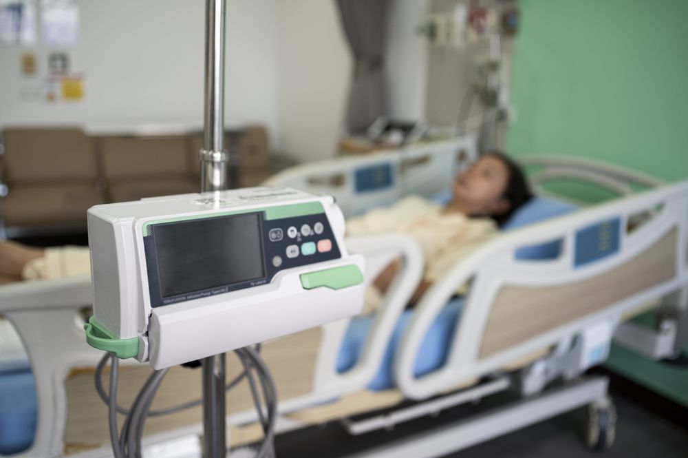 Asian female patient recovering from illness in hospital room, health care concept.