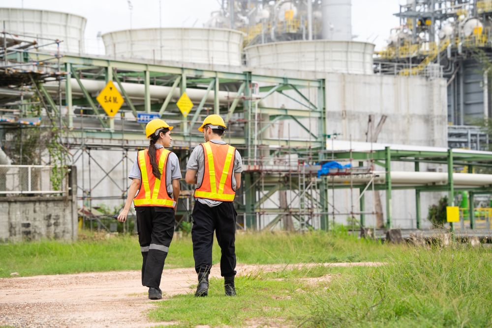 Engineer worker checking project at petrochemical factory or refinery oil plant industrial.