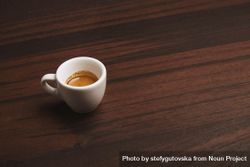 Single espresso shot on wooden table 56W1L4