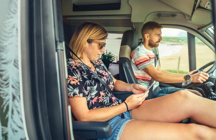 Couple traveling in camper van