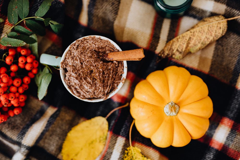 Top view of pumpkin beside desert on table