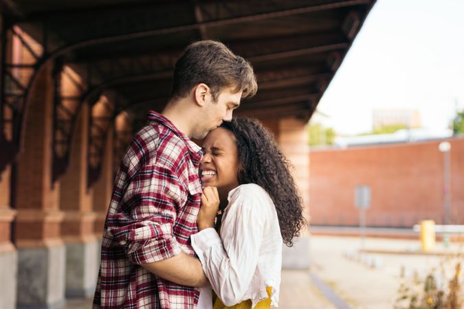 Young couple meeting at the station after a trip