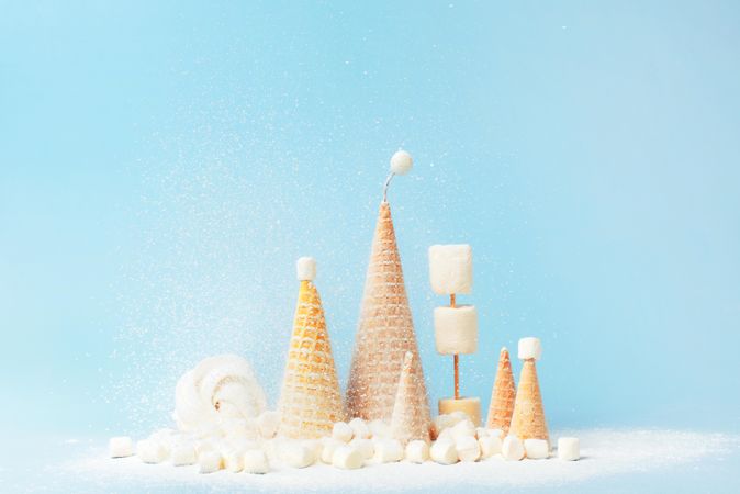 Christmas trees made form waffle cones and marshmallows with powdered sugar