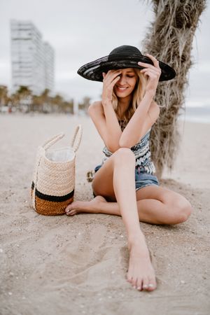 Young female relaxing on beach