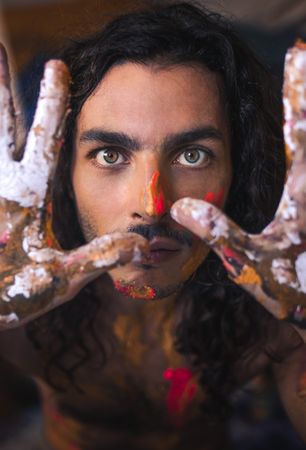 Man with painting on his face and hands