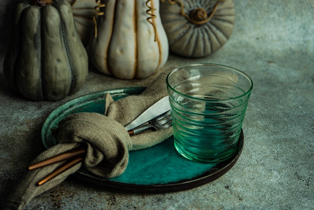 Ceramic pumpkin decorating teal place setting