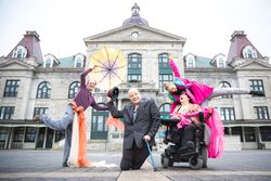 MONTREAL, QUEBEC, CANADA – May 10 2018- Group of performers with sheets and umbrellas