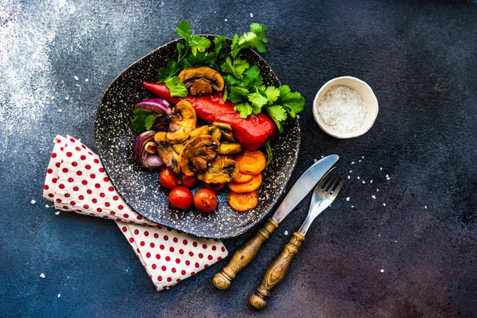 Plate of grilled vegetable on counter with copy space