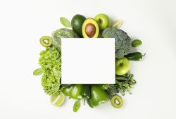 Fresh green vegetables and space for text on blank background