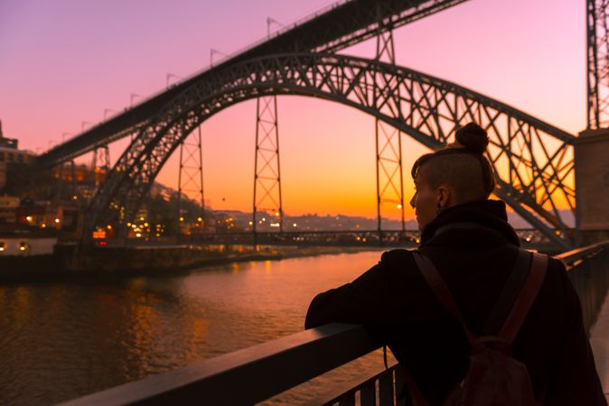 Female standing on embankment during sundown
