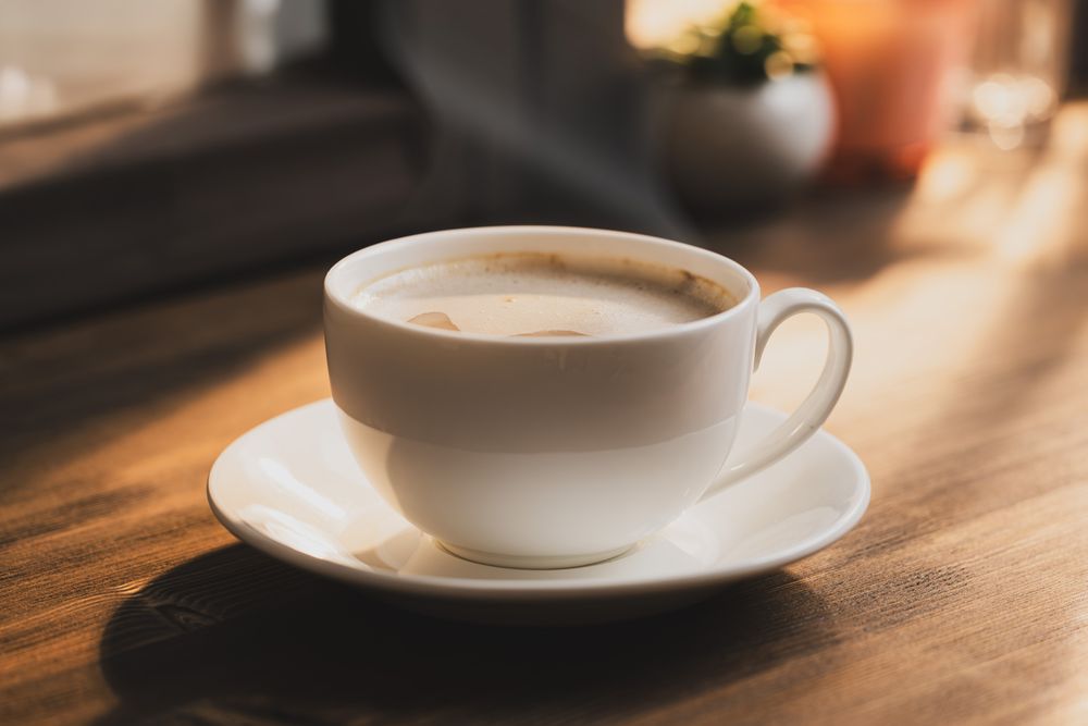 Warm Coffee Cup on Table