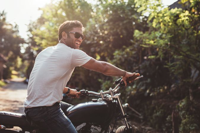 Portrait of handsome young man on motorcycle