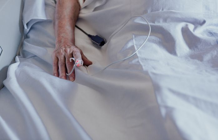 Older man admitted to a hospital room.