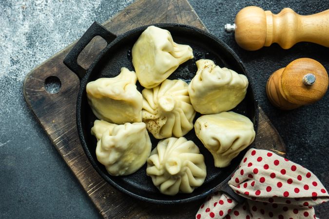 Iron cast pan of traditional Georgian khinkali dumplings