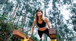 Athlete woman training on parallel bars