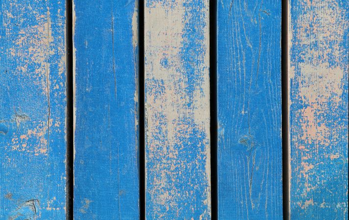Old wooden texture with chipping blue paint