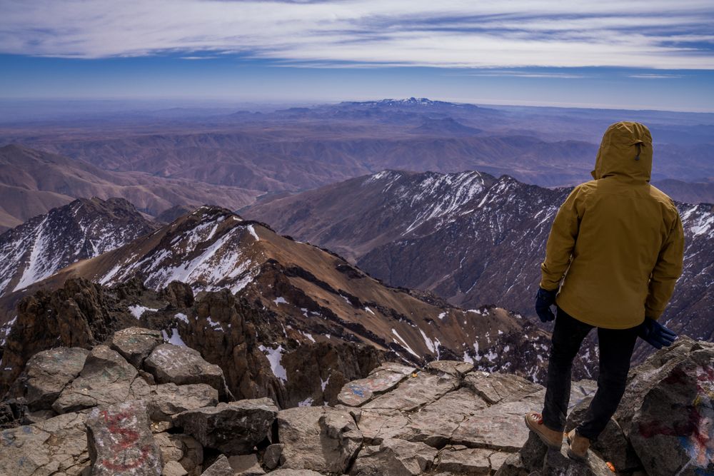 Hiker enjoying majestic view at mountain top