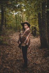 Young female resting in autumn forest