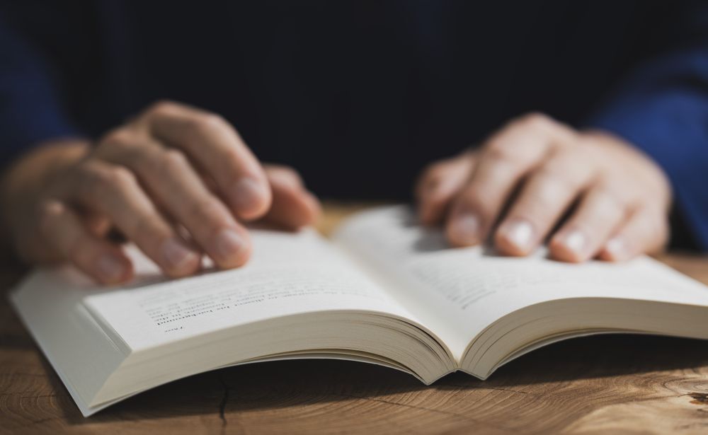 Man Reading Book Close-Up