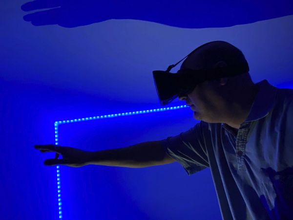 Man wearing virtual reality headset indoor