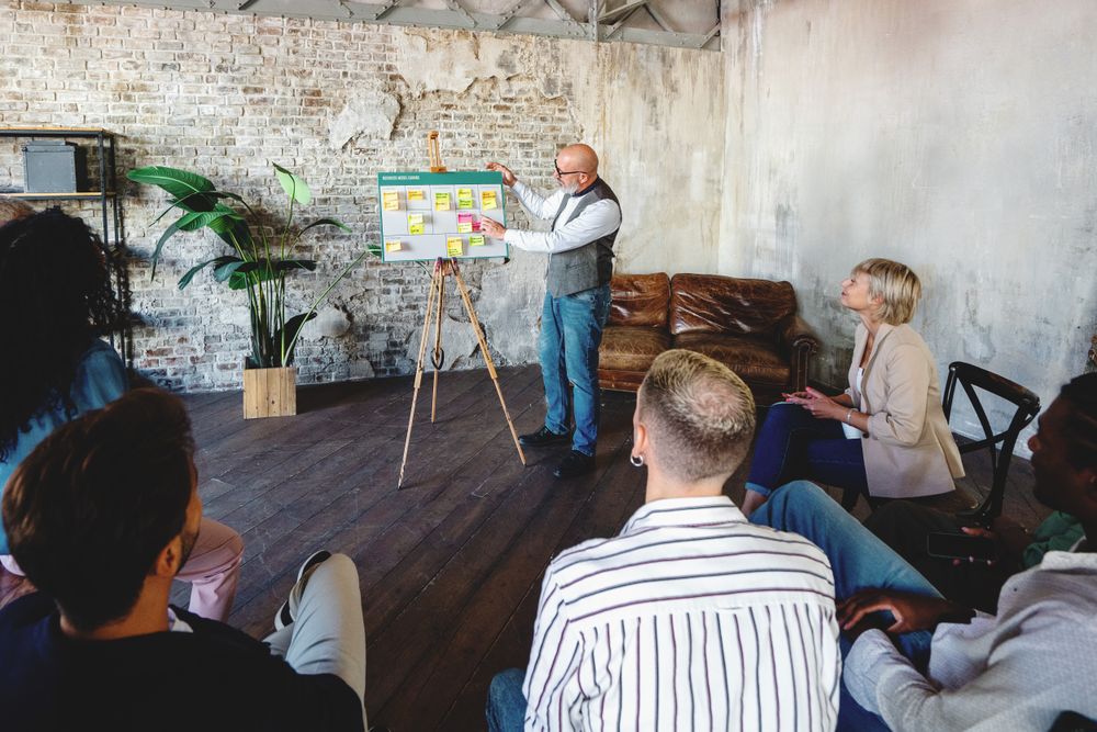 Businessman showing a startup project using a canvas