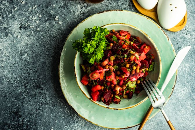 Top view of organic beetroot salad on stone background with copy space