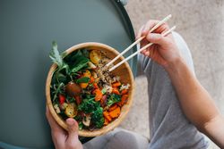 Man with vegetable bowl