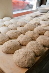 Loaf-shaped bread dough on the table