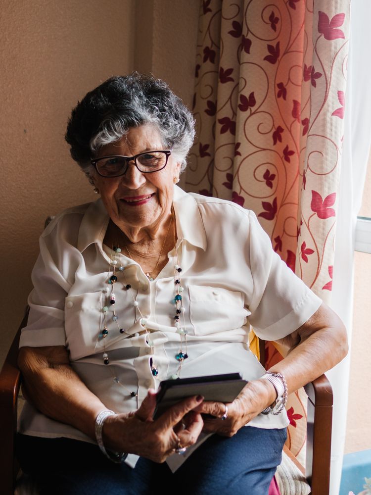 Older female reading e-book at home
