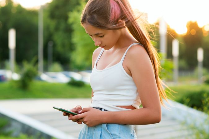 Teen girl using smartphone