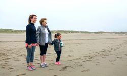Three generations female watching the sea