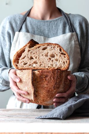 Hands of woman holding bread