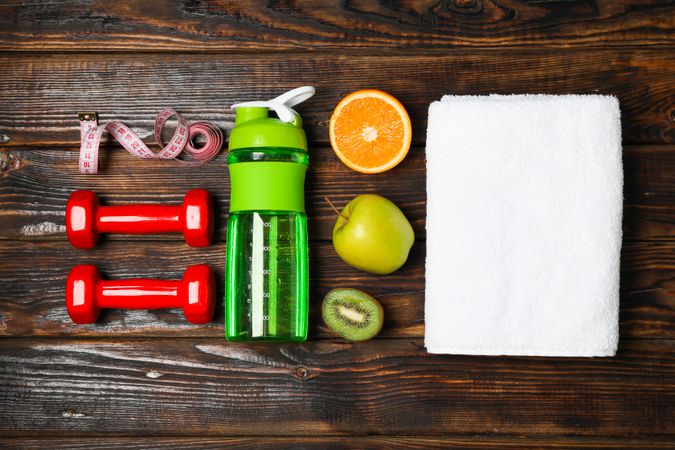 Flat lay composition with healthy lifestyle accessories on wooden background