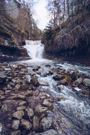 Cascade mountain river at autumn forest