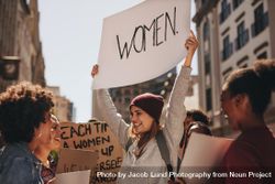 Group of multiracial women protesting outdoors with placards 5X6mkb