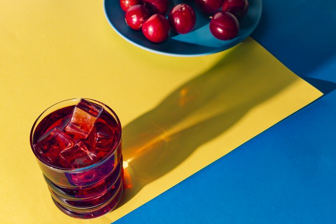 Red drink near fresh fruits