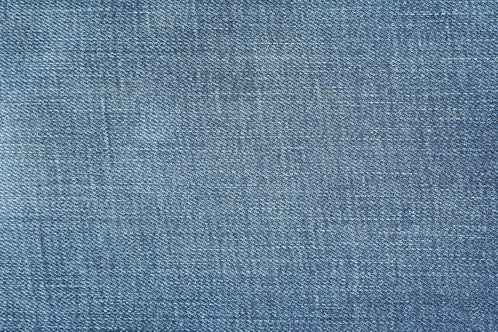 Texture of blue jeans as background, space for text
