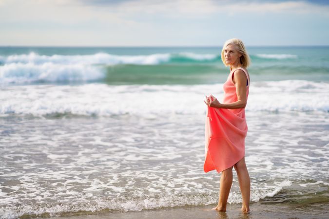 Mature woman looking out to beautiful ocean